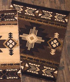 two brown and white rugs sitting on top of a wooden floor next to each other