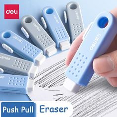 the push pull eraser is in blue and white with five different sized clips attached to it