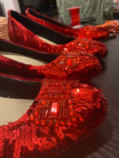 Handmade ruby slippers - just like Dorothy wears in The Wizard Of Oz. Very comfortable - great for costume parties, cosplay or theatrical productions.  Alternative colours and minor modifications available on request. Handmade by me in Melbourne, Australia. Each shoe takes about 3-4 hours to complete. (One pair 6-7 hours), excluding all the undercoating. I do my very best to get these shoes as close as possible to the original designs. I even use the original blueprints for the bows. Available s Ruby Slippers Wizard Of Oz, Wizard Of Oz Shoes, Grad Shoes, Silver Slippers, Womens Costumes, Ruby Slippers, Costume Parties, The Wizard Of Oz, 7 Hours