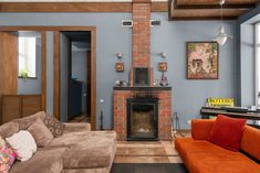 a living room filled with furniture and a fire place