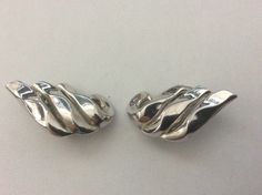 "Trifari silver plated wave clip-on earrings. Excellent vintage condition. 1960-s. size - 1.25\" x 0.75\"" Retro Silver Metal Clip-on Earrings, Silver Retro Metal Clip-on Earrings, Silver Metal Clip-on Earrings For Formal Occasions, Formal Silver Metal Clip-on Earrings, Vintage Silver Sterling Silver Clip-on Earrings, Retro Silver Earrings For Formal Occasions, Silver Retro Earrings For Formal Occasions, Jun 2023, Clip On Earrings