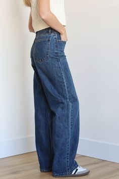 Perfect for a comfortable and stylish look. With a 12" rise and 31" inseam, these jeans offer a flattering and versatile fit. The loose fit and 100% cotton fabric provide ultimate comfort, while the dark denim adds a touch of sophistication. Embrace a classic and timeless style with our High Waisted Skater Jeans. 100% Cotton High Waisted Loose Fit Full Length 12” Rise 31” Inseam 9.5” Opening Color: Dark Denim Dark Denim Pants Outfit, Loosely Fitted Dark Wash Denim Bottoms, Dark Blue Denim, Classic Baggy Dark Wash Jeans, Wide-leg Dark Wash Denim Pants, Dark Denim Jeans Outfit, Dark Wash Relaxed Fit Full-length Jeans, Dark Denim Pants, Loose Jeans Outfit