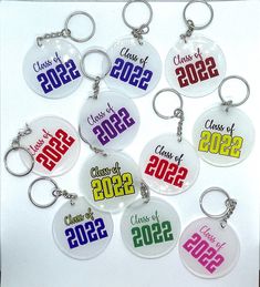 a bunch of key chains that have been made to look like badges for class of 2012