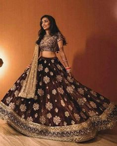 DESCRIPTION The Stunning full flared chocolate brown and beige Indian bridal lehenga in high-quality fabric styled with riced copper and gold zari, dabka, Sequence and zardoze work blouse paired with stunning same work embellished choli with heavy border. Dupatta: Pure chiffon full embellished dupatta with four-sided border in elegant beige color. ADDITIONAL INFORMATION SKU B1975 Detailing Dabka, Zari, Nagh, zardozi and Sequence work Colour Dupatta: Beige, Top: Chocolate brown, Bottom: Chocolate Brown Lehenga, Pakistani Lehenga, Sari Lehenga, Indian Reception, Indian Lehenga Choli, Indian Bridal Lehenga, Indian Party Wear, Indian Bridal Dress, Indian Bridal Wear