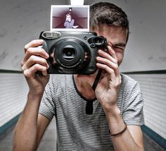 a man taking a photo with his camera