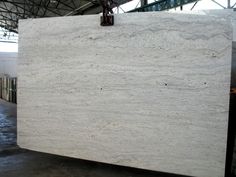 a large white marble slab in a warehouse