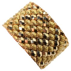 Audaciously gold, this finely Italian made bracelet is superb in rich eighteen karat 18K yellow gold. Striking marquise links in complementing bright polish and textured finishes boldly wraps the wrist in this generous 1-5/8 inch wide flexible cuff style bracelet. The length measurement of this extraordinary piece is is 7-5/8 inches and it is finished with a box clasp and two safety clips. Gift boxed. Pyramid Bracelet, Flexible Bracelet, Retro Bracelet, Expensive Jewelry Luxury, 18k Gold Bracelet, White Gold Hoops, Gold Link Bracelet, Rose Gold Beads, Antique Bracelets