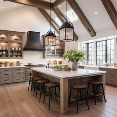 a large kitchen with an island and lots of counter space