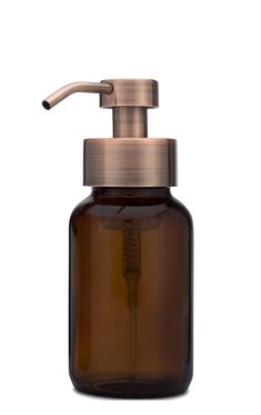 a brown glass soap dispenser with a metal faucet on top