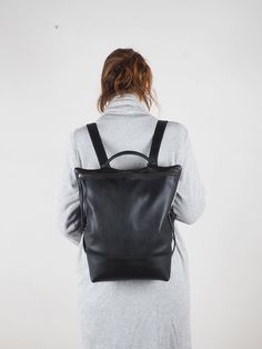 "Black Leather backpack purse women, laptop backpack, zipper backpack, backpack bag, handmade backpack, black leather backpack, minimal bag Handmade HIBRID black Leather Backpack is characterized by its hand crafted and material quality and locally sourced. Large capacity backpack designed with cowleather. Details: Back metalic Zipper clousure. Zipper pocket on the back. Inside leather pocket smartphone size Leather handel and black cotton straps + black leather adjustable. * Color: base black c Minimalist Leather Backpack For Daily Use, Minimalist Everyday Backpack, Minimalist Leather Backpack For On-the-go, Minimalist Backpack With Adjustable Strap, Minimalist Backpack For Everyday Use, Minimalist Backpack For Daily Use, Minimalist Everyday Standard Backpack, Minimalist Black Leather Backpack For Daily Use, Black Minimalist Backpack For Everyday