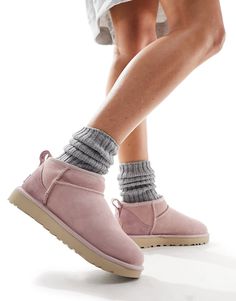 Slippers by UGG Good things come in pairs Pull tab for easy entry Signature UGG branding Round toe Treadlite by UGG™ outsole Textured tread Uggs Ultra Mini, Classic Boots Woman, Pink Suede Boots, Ultra Mini Boots, Pink Ugg Boots, Ugg Ultra Mini, Mini Boots, Pink Uggs, Chestnut Uggs