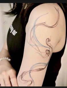 a woman with a tattoo on her arm