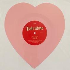 a pink heart shaped vinyl record with the word valentine on it