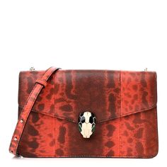 This is an authentic BULGARI Karung Serpenti Forever Small Shoulder Bag in Red. This chic clutch is crafted of karung leather in red. It features snake chain and enamel inlay snakehead closure. The bag opens with a snap to a black fabric interior with a patch pocket. Small Shoulder Bag, Snake Chain, Black Fabric, Patch Pocket, Shoulder Bag, Chain, Red, Leather, Fabric