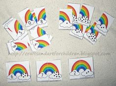 rainbows and clouds are on the floor with numbers for each child's number