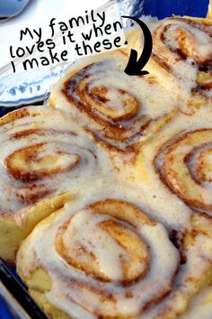 cinnamon rolls in a glass baking dish with text overlay that reads copycat recipe cinnamon cinnamon rolls