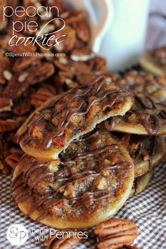 a pile of pecan pie cookies with chocolate drizzled on top and the words pecan pie cookies above it