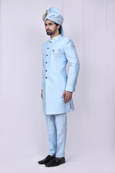 Sky blue sherwani with embroidered mandarin collar and patch pocket. Paired with pant.
Components:2
Neckline:Mandarin
Sleeve Length:Full Sleeves
Fabric:Art Silk
Color:Blue
Other Details:
Patch pocket
Note: Brooch, head accessory worn by the model is not for sale
Occasion:Wedding - Aza Fashions Blue Traditional Wear With Dabka For Groom, Blue Long Sleeve Traditional Wear For Groom, Blue Traditional Wear For Groom, Blue Sherwani For Groom Diwali Occasion, Blue Sherwani For Groom At Eid, Blue Bandhgala For Groom On Eid, Blue Bandhgala For Groom At Eid, Blue Bandhgala For Groom At Diwali, Blue Nehru Jacket For Groom On Eid