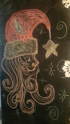 a chalkboard drawing of a person wearing a santa hat