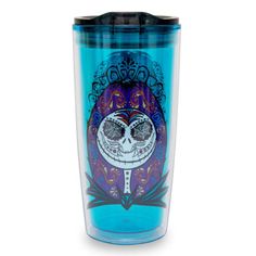 a blue tumbler cup with a sugar skull on it