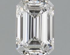 an emerald cut diamond on a gray background