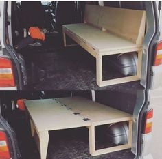 the back end of a van with two tables in it