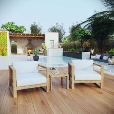 two white chairs sitting on top of a wooden floor next to a swimming pool in a backyard