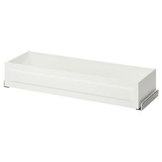 a white shelf with two drawers on each side