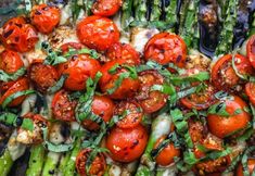 asparagus, tomatoes and other vegetables on a platter