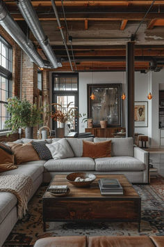 a living room filled with furniture and lots of windows