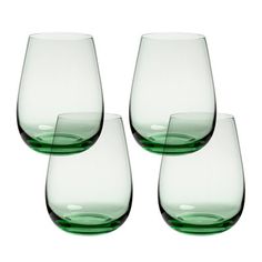 four wine glasses sitting next to each other on top of a white surface with green rims