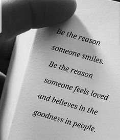 someone is holding an open book with the words be the reason, someone smiles, be the reason