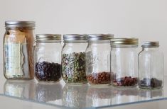 several jars filled with different types of spices