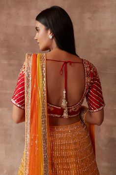 Mango sorbet lehenga with all-over zari and sequin embroidered floral motifs. Comes with blouse and dupatta.
Component: 3
Pattern: Embroidery
Type Of Work: Zari and Sequin
Neckline: Leaf
Sleeve Type: Half
Fabric: Silk and Tulle
Color: Orange
Other Details: 
Shaded dupatta with border
Low back with tie up and tassels
Closure: Back hook
Occasion: Bride - Aza Fashions Fitted Orange Pre-draped Saree For Wedding, Orange Pre-draped Saree With Unstitched Blouse For Wedding, Orange Pre-draped Wedding Saree With Unstitched Blouse, Wedding Orange Pre-draped Saree With Unstitched Blouse, Orange Unstitched Blouse Wedding Sets, Orange Pre-draped Saree For Wedding And Navratri, Orange Wedding Sets With Unstitched Blouse, Orange Lehenga With Unstitched Blouse In Georgette, Orange Lehenga With Unstitched Blouse For Reception