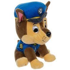 a stuffed dog with a blue hat and vest on it's head is sitting down