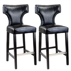 pair of black leather bar stools with studded backrests and nail accents