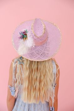 Get ready to turn heads with THE PENELOPE SUN HAT! This lavender beauty features gold accents, a pretty pink ribbon band, delicate white feathers, and a colorful flower combo. Protect your skin in style and add a touch of whimsy to any outfit. This hat is ONE OF A KIND, created by our owner Stephanie. To receive item quicker, expedited shipping is available at checkout. Pink Bohemian Sun Hat With Flat Brim, Fun Pink Sun Hat With Upf 50+, Playful Pink Adjustable Sun Hat, Pink Sun Hat With Upf 50+ And Curved Brim, Handmade Pink Sun Hat, One Size, Baseball Trucker Hat, Usa Dresses, Bride Accessories, White Feathers