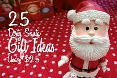 a santa clause figurine sitting on top of a bed with polka dot sheets