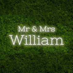 the words mr and mrs william are lit up in white light on green grass,