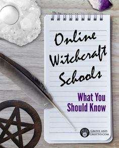 a notepad with the words online wikikrat school written on it next to a pen, magnifying glass and other items