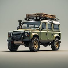 a green land rover vehicle with luggage on top