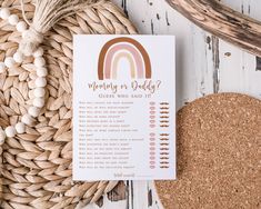 a white card with a rainbow on it next to a basket and some other items