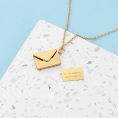 Get that special person in your life a beautiful gift for Valentine's or an anniversary with our personalised secret message envelope necklace. This stylish accessory doubles up as a memorable keepsake your loved one will keep close to their heart and treasure forever. Open up the envelope pendant to reveal a hidden heartfelt message only the recipient will know about. It also comes beautifully packaged in a stylish Treat Republic branded gift box.   Personalise her rectangular photo locket with Minimalist Personalized Locket Necklace For Keepsakes, Minimalist Personalized Locket Necklace As Gift, Initial Pendant Locket Necklace With Chain As Gift, Envelope Shaped Necklace For Mother's Day Gift, Gold Personalized Envelope-shaped Necklace, Personalised Pendant, Envelope Necklace, Message Envelope, Personalized Pendant Necklace