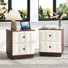 two nightstands side by side with a laptop on top