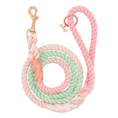 a pink, green and white rope dog leash with gold hardware on a white background