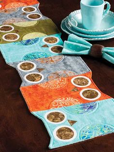 two placemats with different designs on them, one has a cup and saucer