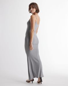 We know you're going to love this one. Tencel™ ribbed knit. Body-hugging fit. Maxi length. Spaghetti straps. Straight neckline. Our soft, comfy Tencel™ is a biodegradable fabric made from cellulose found in wood pulp. It is softer, more breathable, and uses 10-20x less water in production compared to cotton. So you can feel good in looking good.  | Quince | Women's Tencel Rib Knit Maxi Slip Dress in Heather Grey, Size Large, Cotton/Modal Fitted Ribbed Bodycon Dress For Loungewear, Solid Ribbed Bodycon Dress With Spaghetti Straps, Maxi Slip Dress, Rib Knit, Heather Grey, Ribbed Knit, Spaghetti Strap, Slip Dress, Spaghetti