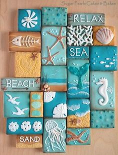 an image of some cookies on a wooden board with sea animals and seashells