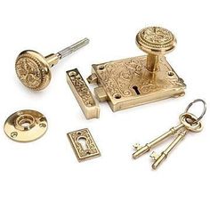 an assortment of brass door knobs and keys