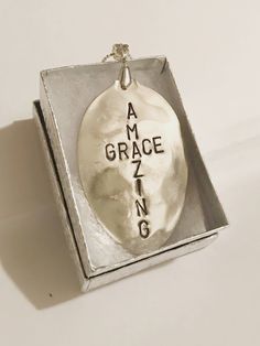 "The perfect gift to carry the meaning of Christmas throughout the entire year. On the good days and the not-so-good days, we know He is always with us, giving us the help we need to live a life that brings Him glory. This handstamped pendant makes that message beautifully clear. Handcrafted from a vintage silver spoon, this pendant has already withstood the test of time. Someday this necklace can be passed on to the next generation, with love and prayers for God's blessing to be upon their live Inspirational Hand Stamped Necklaces For Gift, Inspirational Hand Stamped Necklace For Gift, Inspirational Hand Stamped Necklaces As A Gift, Inspirational Stamped Necklace For Gifts, Inspirational Stamped Necklace As Gift, Cross Necklace Vintage, Amazing Grace Cross, Christian Jewelry For Women, The Meaning Of Christmas